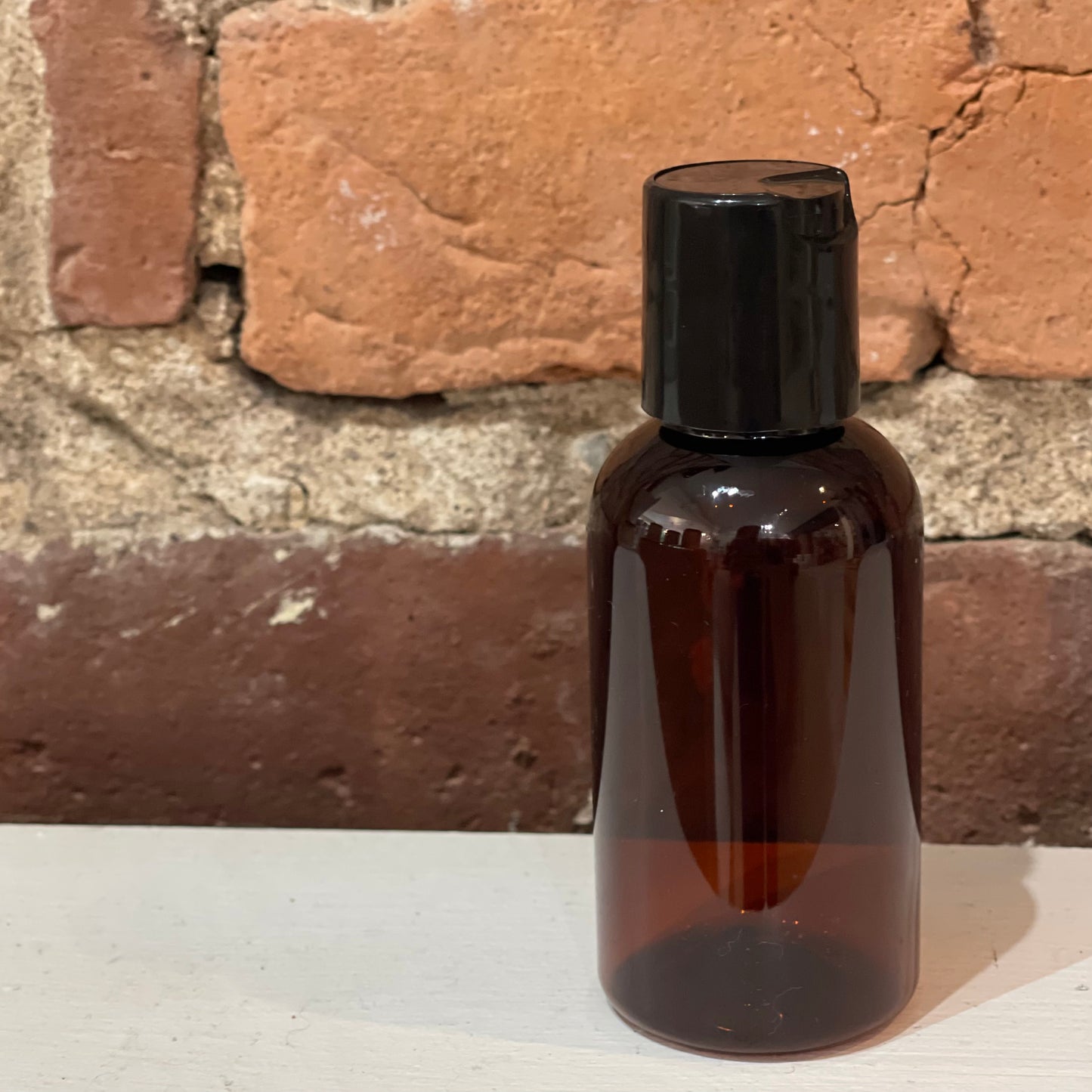 Bouteille en plastique ambré bec verseur