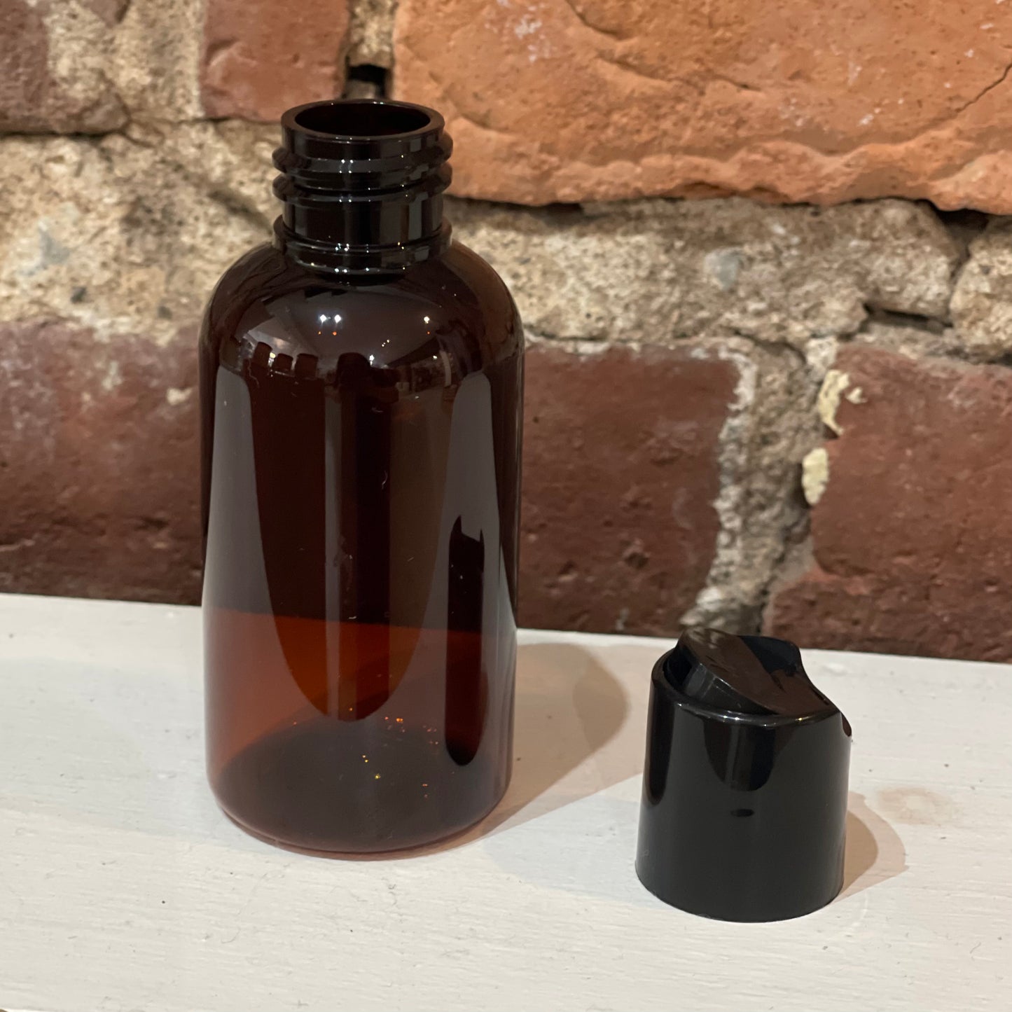 Bouteille en plastique ambré bec verseur